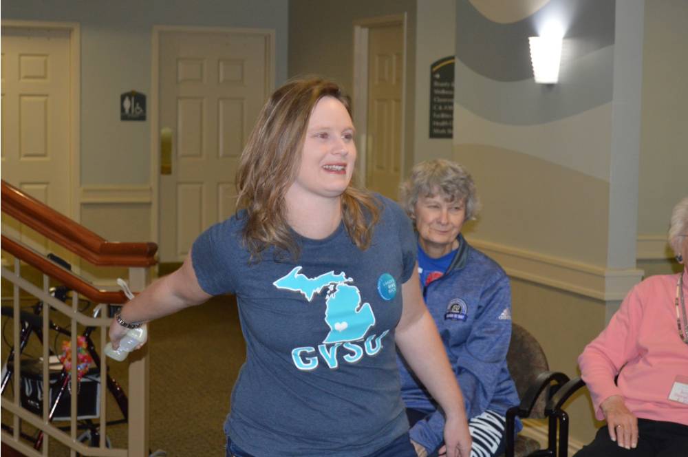 A volunteer plays Wii Bowling.